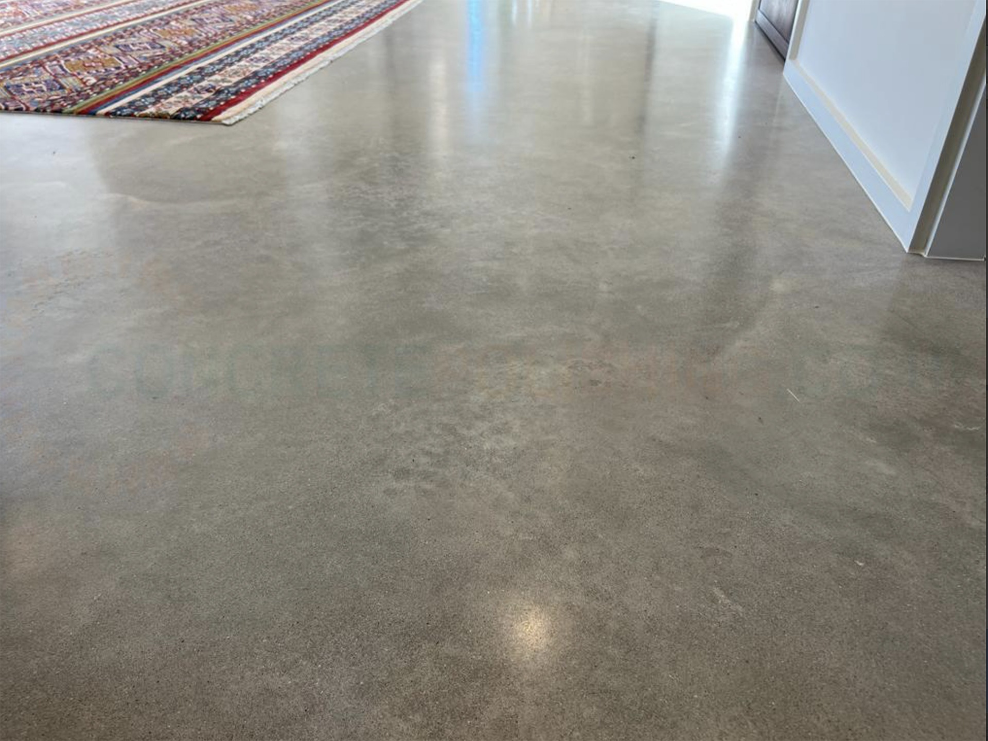 Polished concrete floor with reflective surface