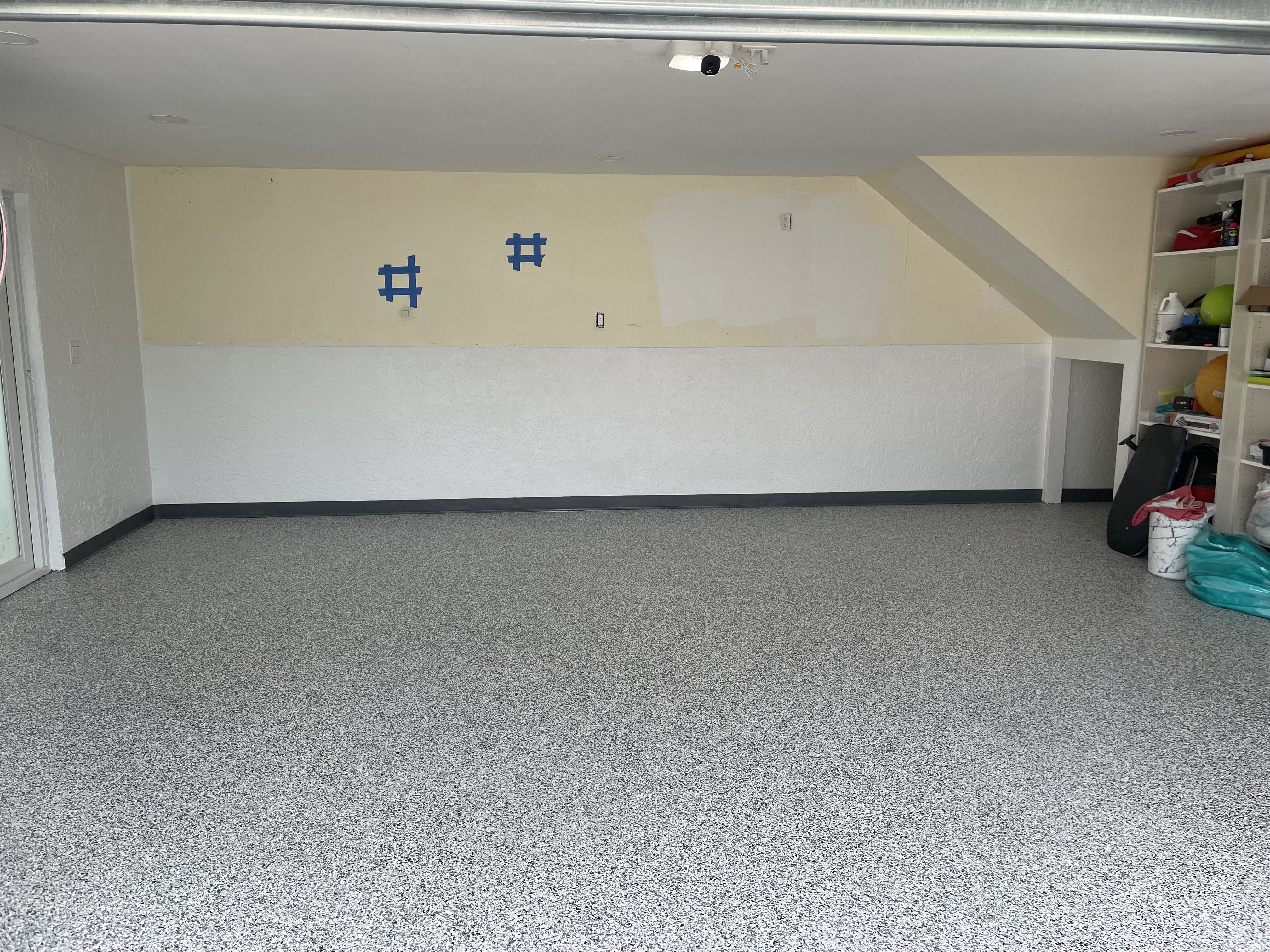 Epoxy-coated garage floor with finished high-shine coating